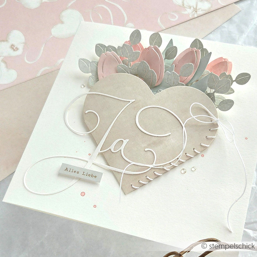 Handgefertigte Karte mit einem Herz, rosa Blumen und dem Schriftzug "Alles Liebe", hergestellt mit Alexandra Renke Motivstanze Tulpensträußchen und hochwertigem Designpapier für ein elegantes Finish.