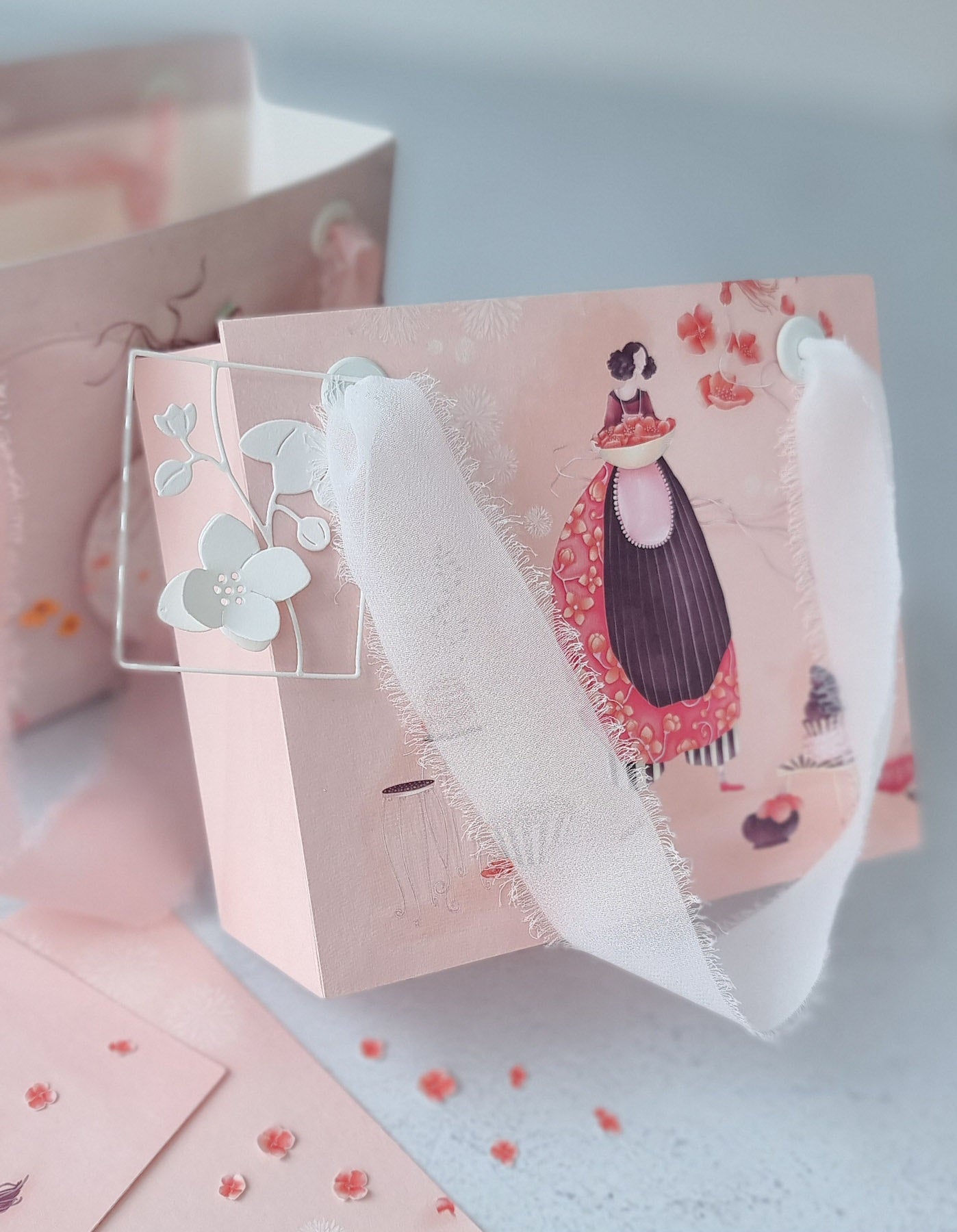 Geschenktüte in rosa mit weißem Band