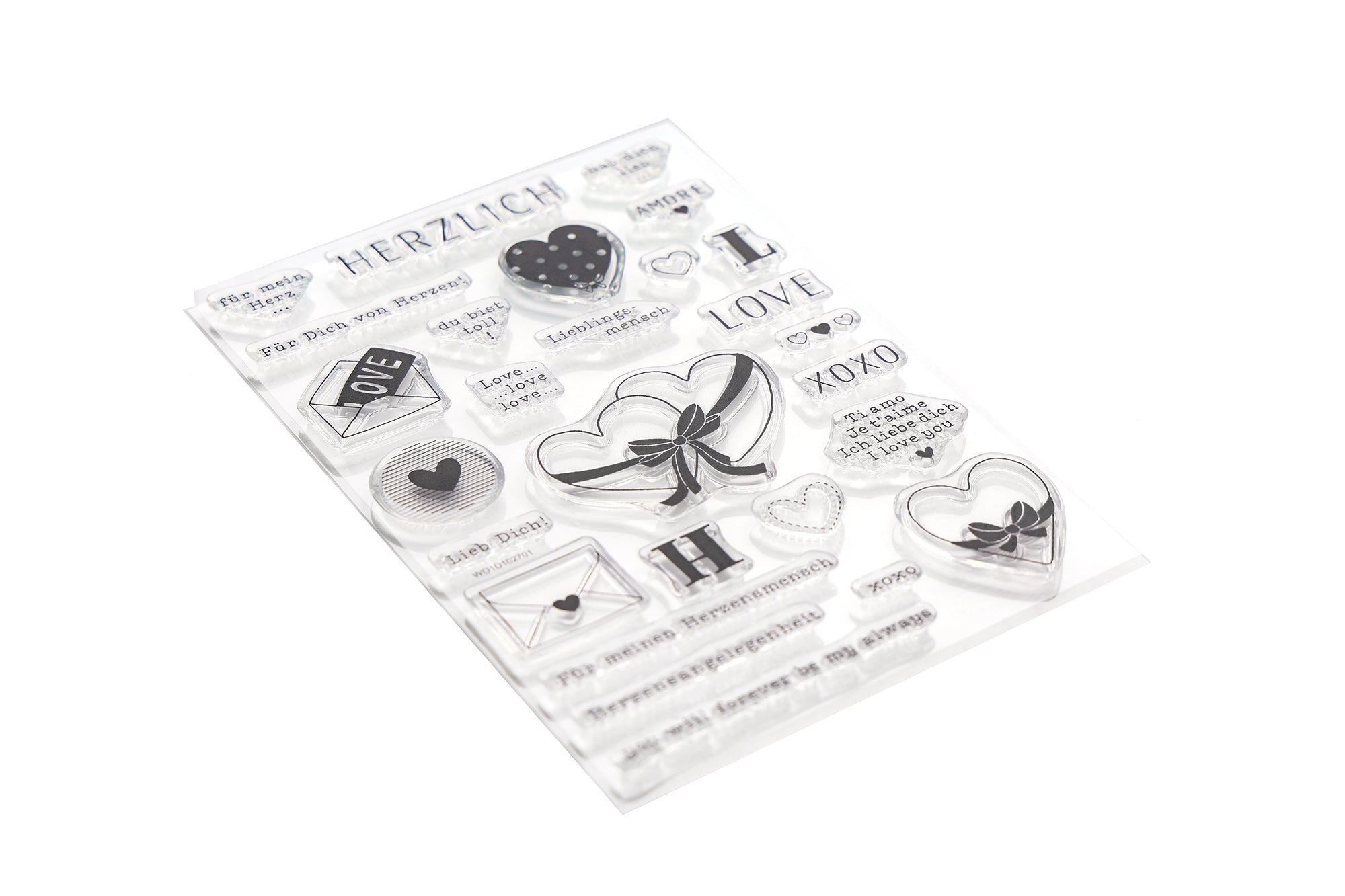 Klare Stempel mit Herzen, Buchstaben und Wörtern wie LOVE, XOXO und HERZLICH auf weißem Hintergrund.