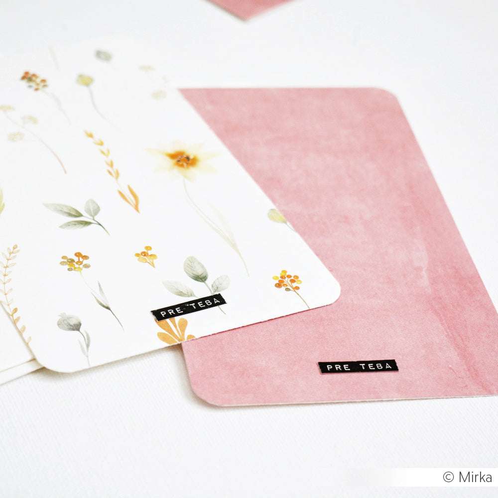 Zwei PRE TEBE-Karten - eine blumige, eine rosafarbene - von Alexandra Renke werden auf weißem Hintergrund dargestellt, ideal für Papierprojekte oder Buchbinderei mit elegantem Designpapier.