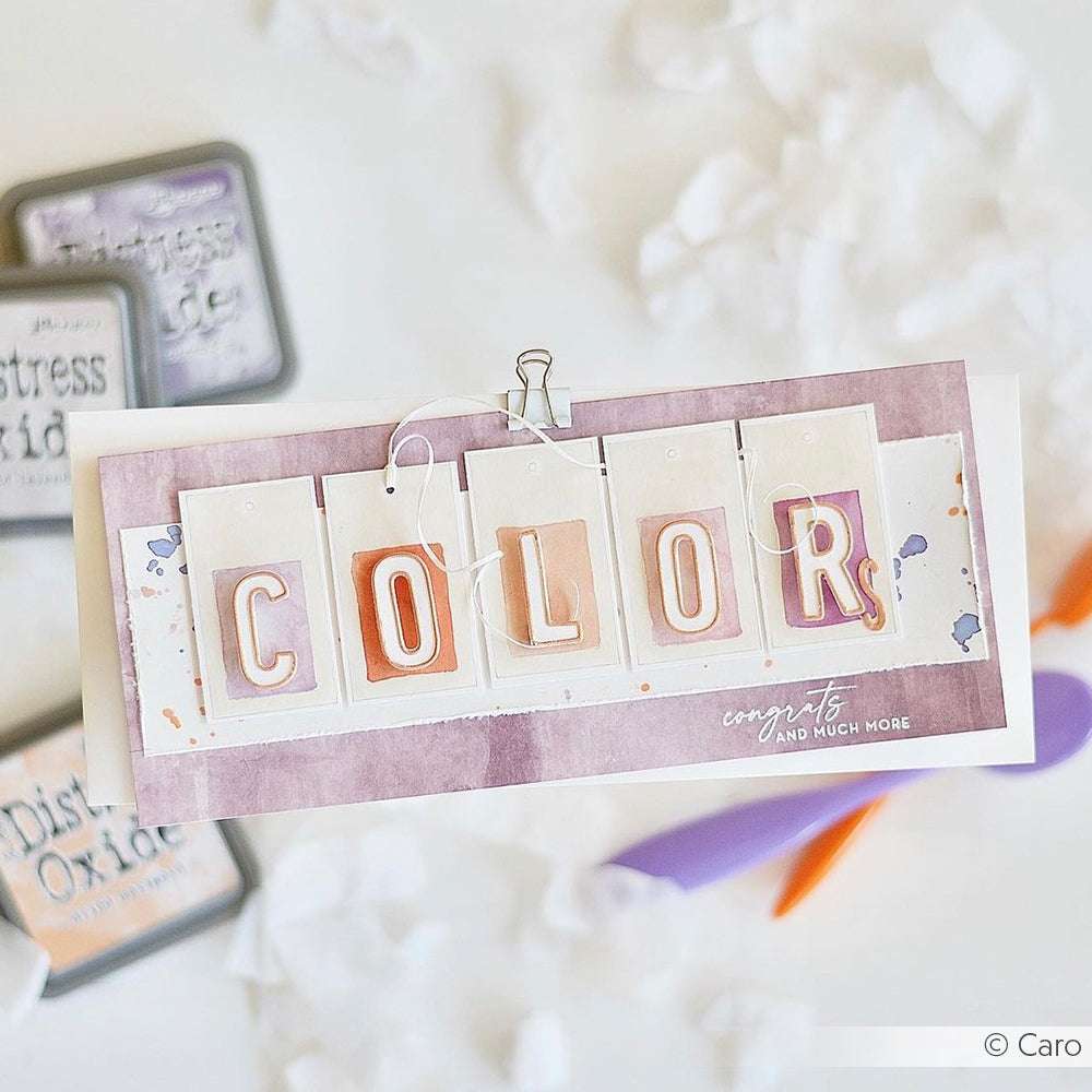 Ein handgefertigtes Grußkarten-Design von Alexandra Renke mit COLOR in fetten Buchstaben, darunter Glückwünsche und mehr in Schreibschrift - ideal für einzigartige Papierprojekte.