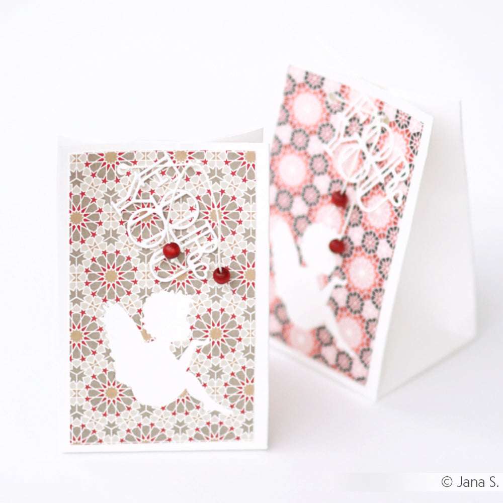 Zwei gemusterte Grußkarten von Alexandra Renke mit weißen Amor-Silhouetten, "Love You"-Schriftzug, roten Punkten und modernen geometrischen Mustern - perfekt für anspruchsvolle Papierprojekte.