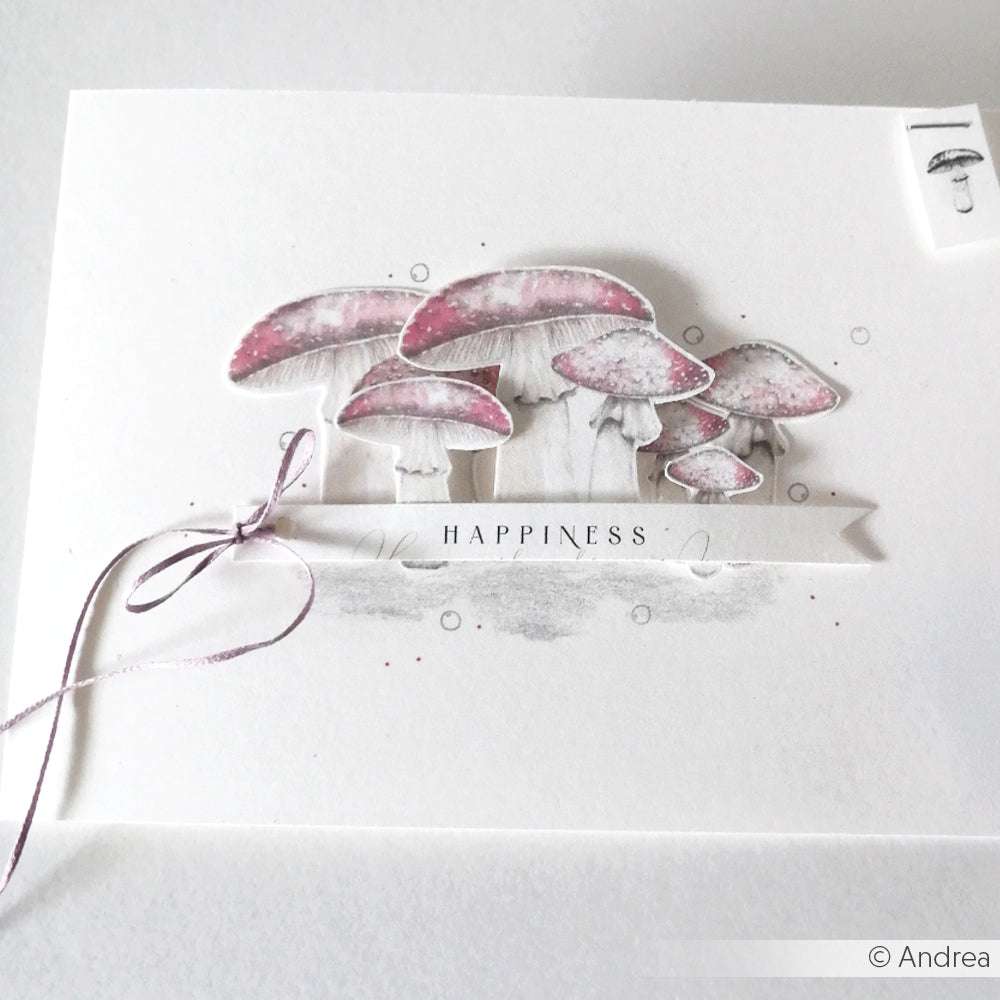 Handgefertigte Karte von Alexandra Renke mit rosafarbenen Pilzen, dem Text "HAPPINESS" und einer lila Schleife auf weißem Hintergrund - hergestellt mit hochwertigem Designpapier für einzigartige Papierprojekte.