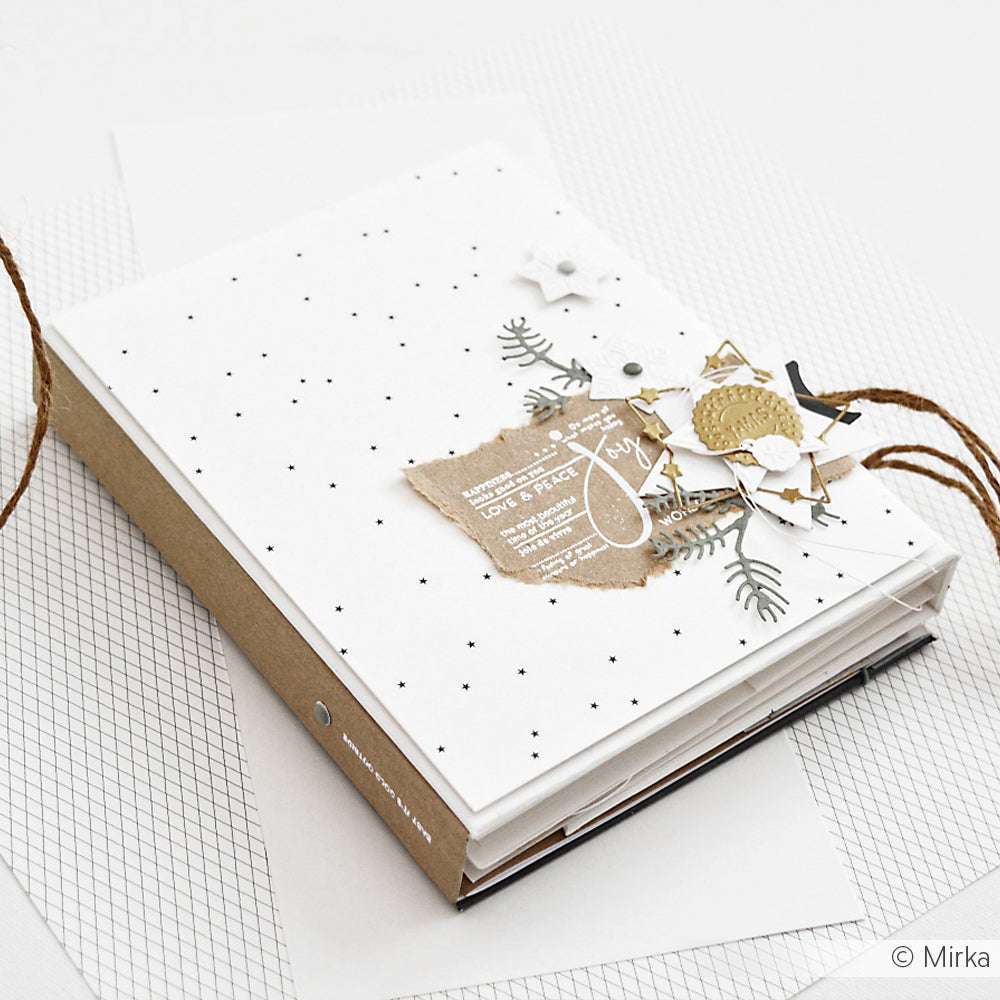 Ein handgefertigtes Scrapbook von Alexandra Renke mit weißem gepunktetem Einband, geschichtetem Designpapier, Bindfäden und Verzierungen - eine tolle Buchbinderei für Ihre kreativen Papierprojekte.