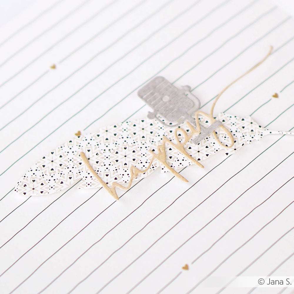 Handgeschriebenes "happy" von Alexandra Renke auf Designpapier mit schwarzen Linien und einer kleinen grauen Verzierung über dem Wort - ideal für Papierprojekte oder um Ornamentsterne zu verzieren.