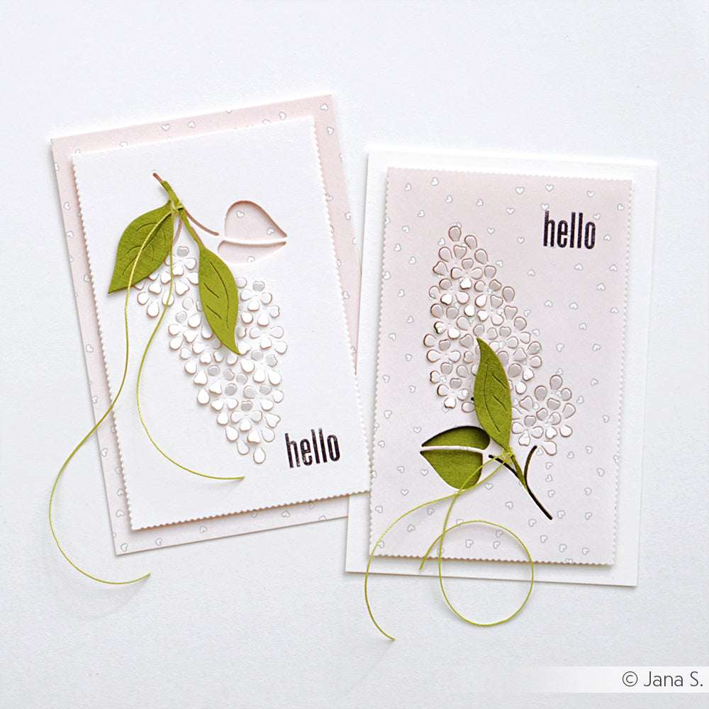 Zwei handgefertigte Grußkarten von Alexandra Renke mit "Hallo"-Text, erhabenen weißen Blumenmustern auf Designerpapier und grünen Papierblättern - ideal für Papierprojekte oder als Herzgestöber auf Rosa.