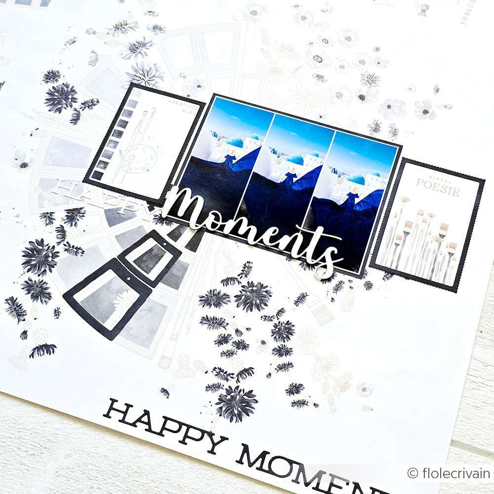 Eine Scrapbook-Seite von Alexandra Renke mit drei Bergfotos, floralen Motiven, Pinseln und "Moments" in Schreibschrift - ideal für kreative Papierprojekte mit Designpapier oder Farbkartenkreis Blau.