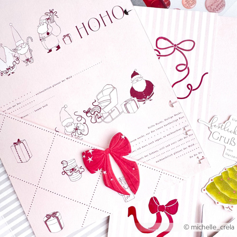 Das rosa Weihnachtsdesignpapier von Alexandra Renke zeigt den Weihnachtsmann, Geschenke, Schleifen und festliche Motive sowie eine rote 3D-Schleife - ideal für kreative Papierprojekte.