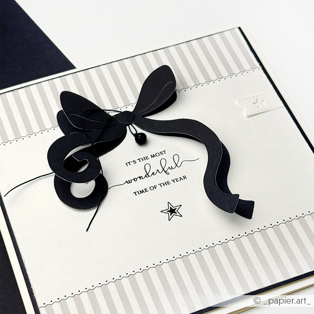 Handgefertigte Karte von Alexandra Renke mit schwarzem 3D-Band, gestreiftem Rand und dem Text "It's the most wonderful time of the year" - ideal für Papierprojekte und hergestellt mit hochwertigem Designpapier.