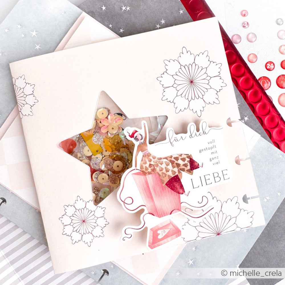 Handgefertigte Karte von Alexandra Renke mit einem sternförmigen Schüttelfenster, floralen Motiven und rosa Verzierungen auf Designpapier - perfekt für Ihre Papierprojekte.