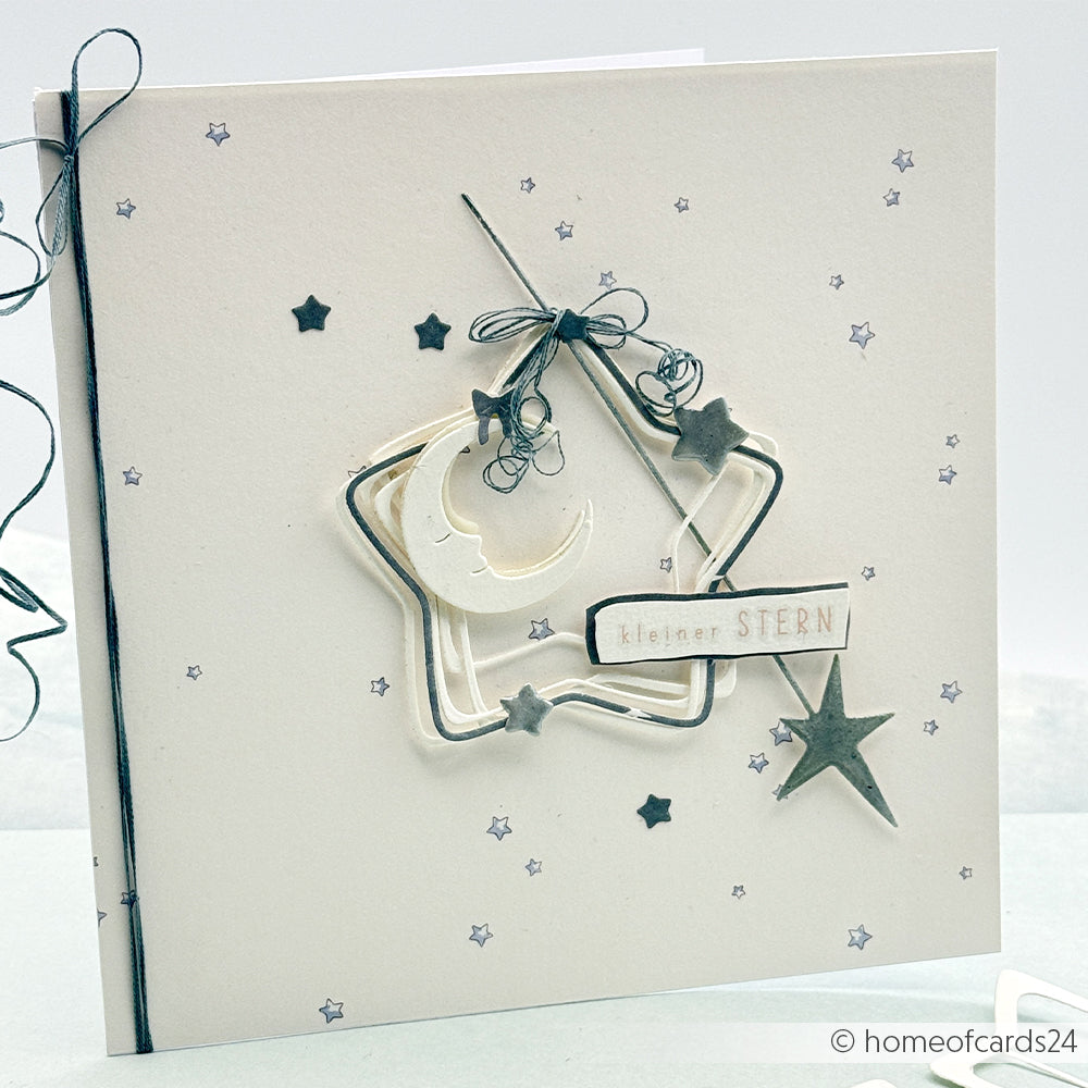Handgefertigte Karte von Alexandra Renke mit Stern, Mond und dem Text "kleiner STERN" auf Designpapier Sternenhimmel hellblau, verziert mit kleinen Sternen und schwarzer Schnur - ideal für Papierprojekte oder Buchbinderei-Fans.