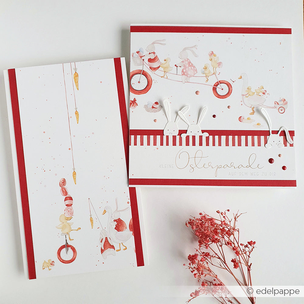 Zwei skurrile Grußkarten zum Thema Zirkus von Alexandra Renke, die mit Designpapier Osterparade und roten Akzenten gestaltet wurden, zeigen Hasen und Mäuse. Zusammen mit Trockenblumen sind sie die perfekte Inspiration für Ihre nächsten Papierprojekte.