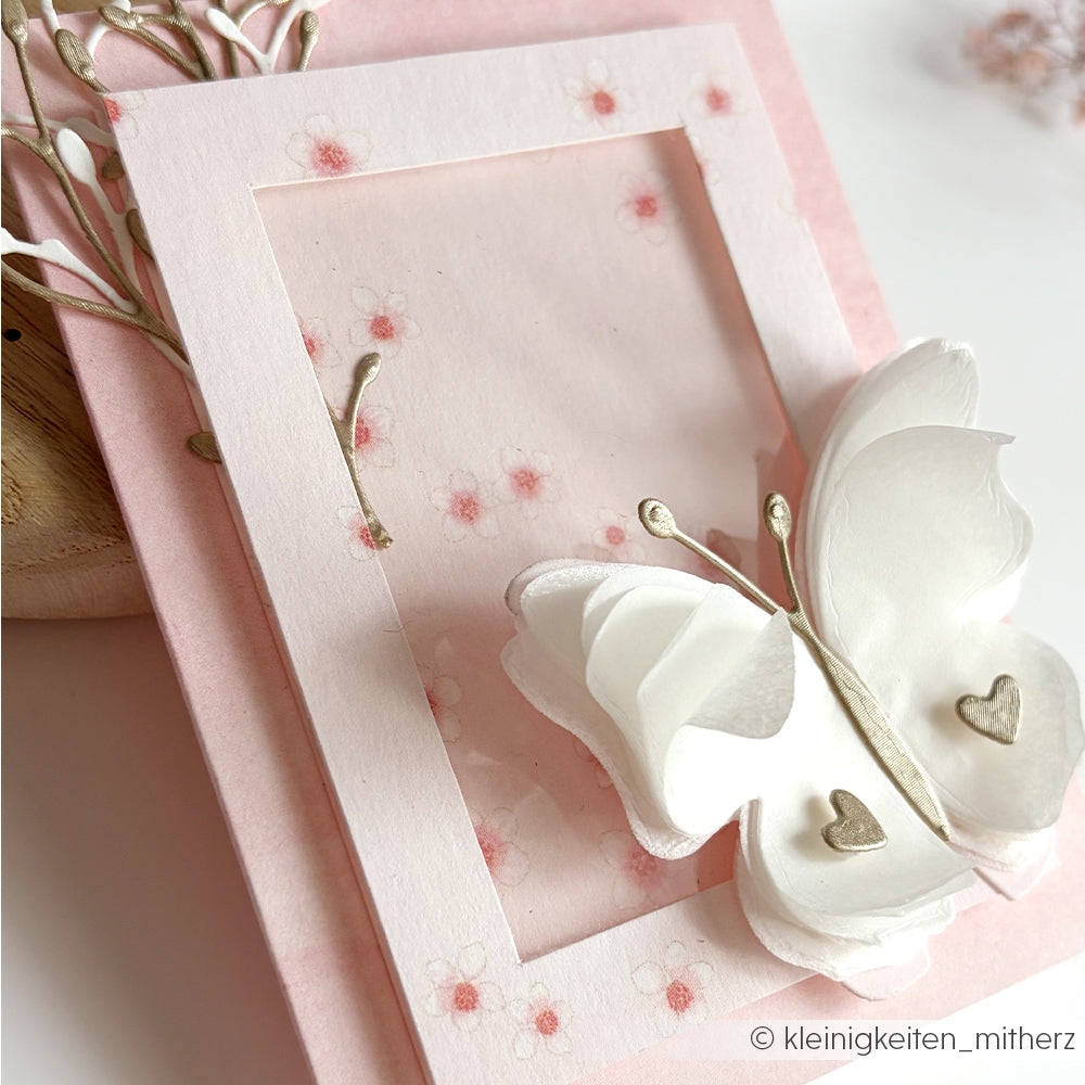 Handgefertigte rosafarbene Karte von Alexandra Renke mit einem weißen 3D-Schmetterling, Herzdetails, Kirschblüten-Akzenten und zarten rosa Blüten - ideal für einzigartige Papierprojekte.