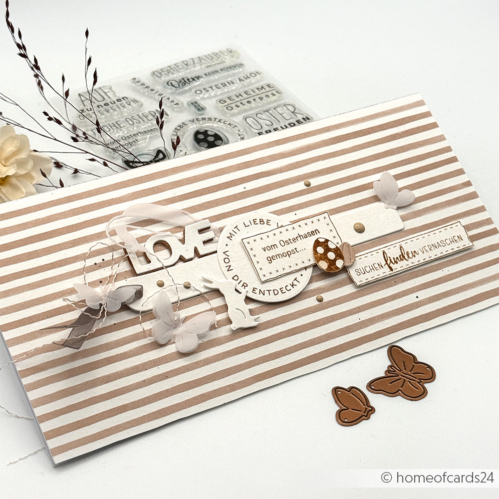 Handgefertigte Karte von Alexandra Renke mit beigen Streifen, 3D-LOVE-Text, Schmetterlingen, Blumen- und Stempelakzenten sowie verschiedenen deutschen Sprüchen - ideal für Papierprojekte-Fans oder alle, die einzigartige Designpapier-Basteleien lieben.