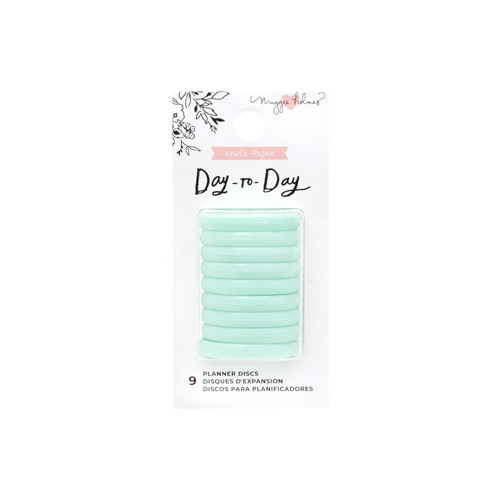 Eine Packung mit neun mintfarbenen Planner Discs von Crate Paper in einer durchsichtigen Verpackung mit der Aufschrift Day-to-Day von Maggie Holmes.