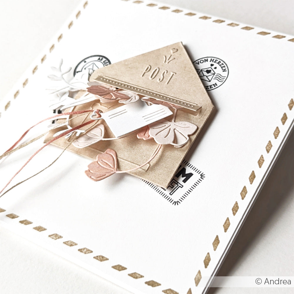 Eine handgefertigte Karte von Alexandra Renke mit einem 3D-Umschlag, Blättern und Briefmarkendetails auf weißem Hintergrund - gestaltet mit dem Cut & Emboss Folder für Textur und Dimension.