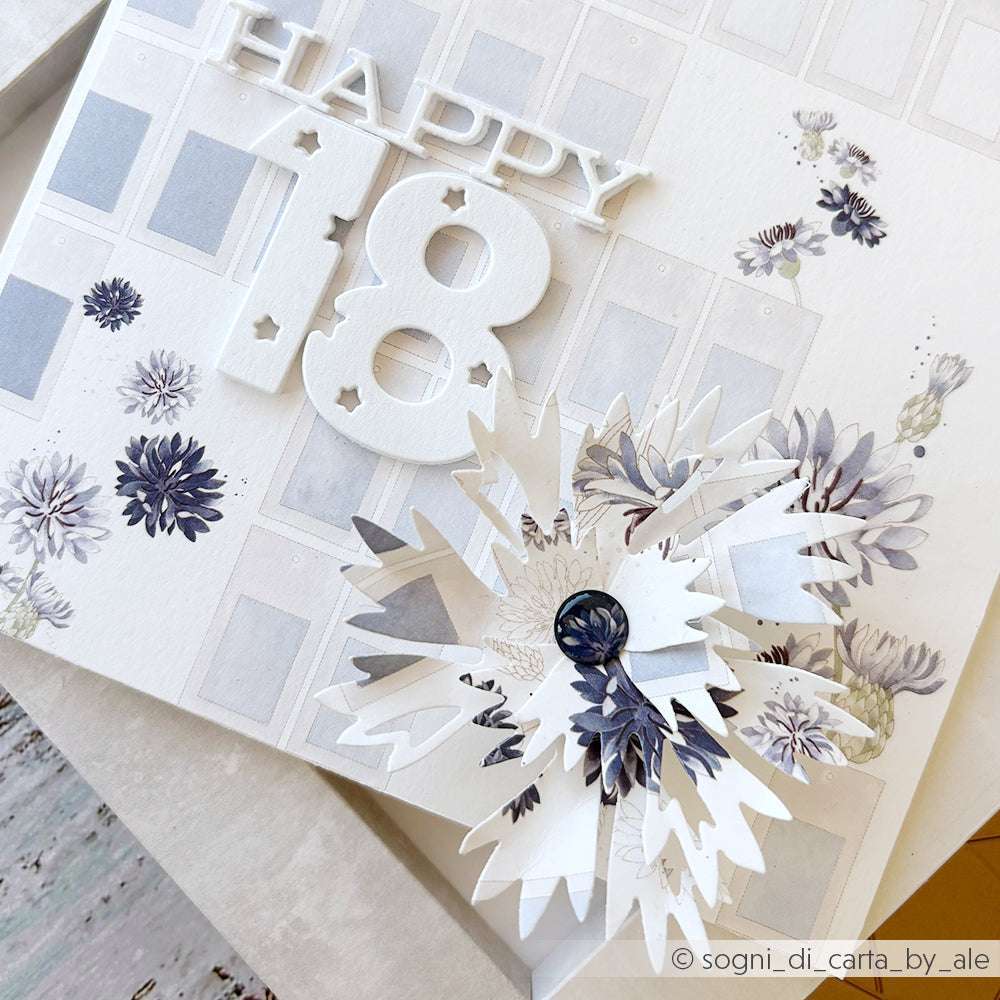 Handgefertigte Karte von Alexandra Renke mit dem Text "HAPPY 18", Papierblumen und Blumenmustern in zartem Lila und Weiß, hergestellt mit PAPPcut®ies für zusätzliche Details.