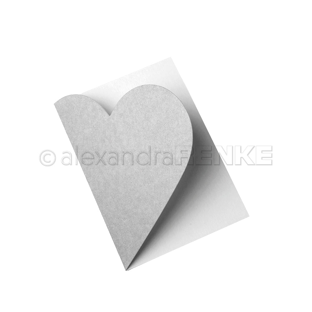 Eine weiße Karte mit herzförmiger Frontklappe, gefertigt mit der Alexandra Renke Motivstanze Herzenskarte Stanzsysteme, ist auf weißem Hintergrund teilgeöffnet - ideal, um einzigartige Designpapiere zu präsentieren.