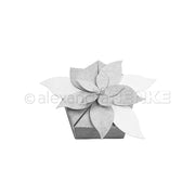 Eine Schachtel, verziert mit einem Weihnachtsstern aus Papier, der aus Designpapier gefertigt wurde.