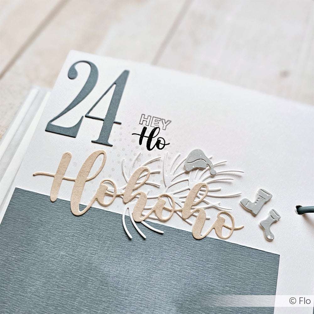 Gestalten Sie eine festliche Scrapbook-Seite mit "24", "Hey Ho", Fäustlingen, Strümpfen und Winterdekoration - perfekt für Ihre Weihnachtspost oder Designs, die mit Alexandra Renkes klaren Photopolymer-Stempeln gemacht wurden.