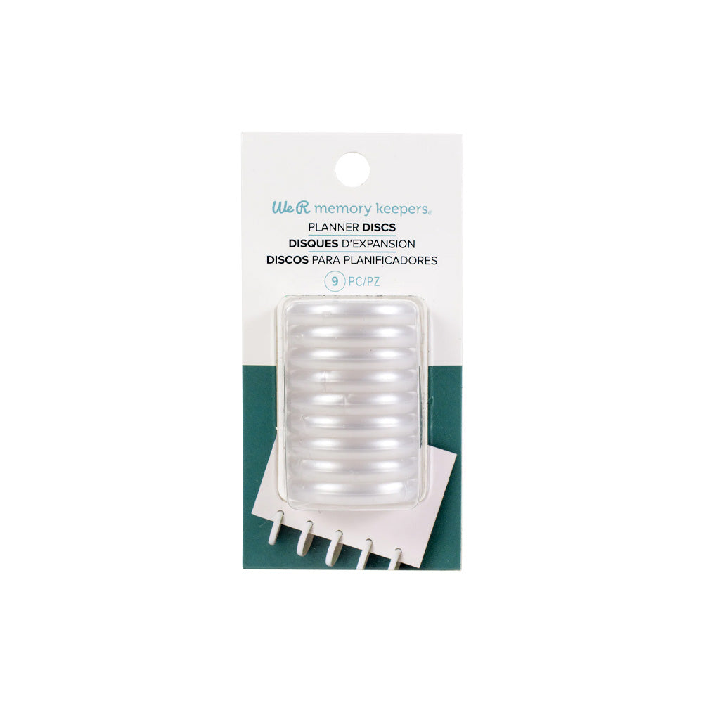 Packung mit weißen Planerscheiben von We R Memory Keepers, mit 9 sichtbaren Bindescheiben in einer durchsichtigen Plastikverpackung.