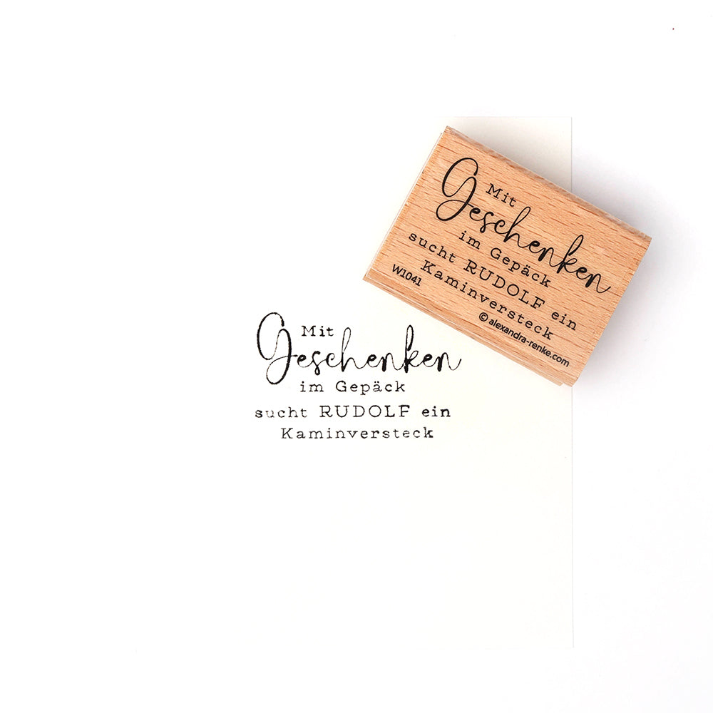 Ein Alexandra Renke Holzstempel mit deutschem Text ist neben seinem Stempelabdruck auf weißem Papier abgebildet - ideal für Papierprojekte oder zur Verwendung mit Ihren Lieblingsstempelkissen.