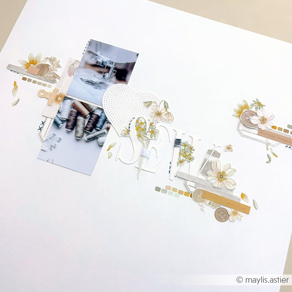 Eine Scrapbook-Seite von Alexandra Renke mit Blumen, Herzmotiven, Garnrollen und Platz für zwei Fotos auf weißem Hintergrund – ideal für Bastelprojekte oder zum Verzieren mit Rub-On-Transferfolien.
