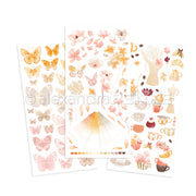 Drei pastellfarbene Stickerbögen von Alexandra Renke mit Schmetterlingen, Blumen und Rubbelmotiven wie Kaffeekannen, Tassen und Teetassen - ideal für Scrapbooking- oder Transferfolien-Bastelprojekte.