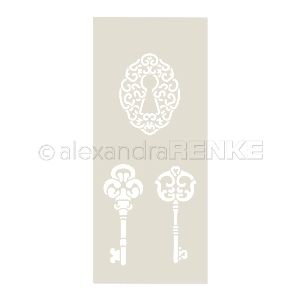 Weiße verzierte Schlüssellochplatte und zwei Vintage-Schlüssel auf Beige, ideal für Alexandra Renke-Fans und Papierprojekte-Künstler, die sich von eleganten Schablonen inspirieren lassen wollen.