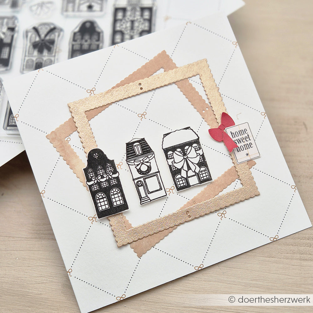 Handgefertigte Karte von Alexandra Renke mit drei schwarz-weißen Hausausschnitten, goldenen Rahmen und einem "Home Sweet Home"-Anhänger mit roter Schleife - perfekt für Papierprojekte oder zum Kombinieren mit Ihren Lieblingsmotiven aus klaren Stempeln.