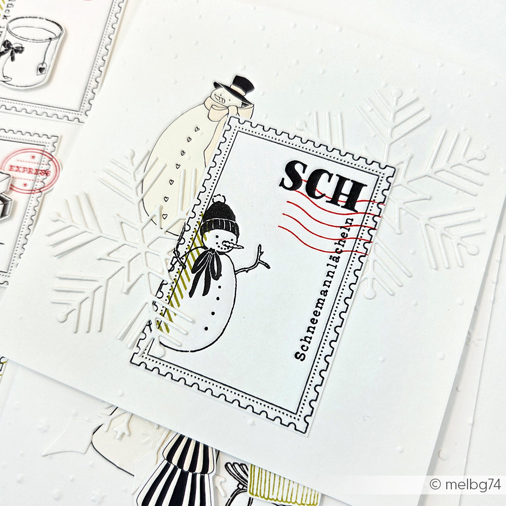 Handgefertigte Winterkarte von Alexandra Renke mit Schneemännern, einer großen Schneeflocke und einer Kompositionsformen Briefmarke mit SCH und roten Wellenlinien, alles gestempelt für ein klares Detail.