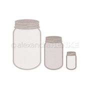 Drei leere Einmachgläser in verschiedenen Größen auf weißem Hintergrund - perfekt, um Ihre Alexandra Renke Motivstanze Marmeladengläser zu präsentieren oder Ihre Lieblingsdesignpapiere aufzubewahren.