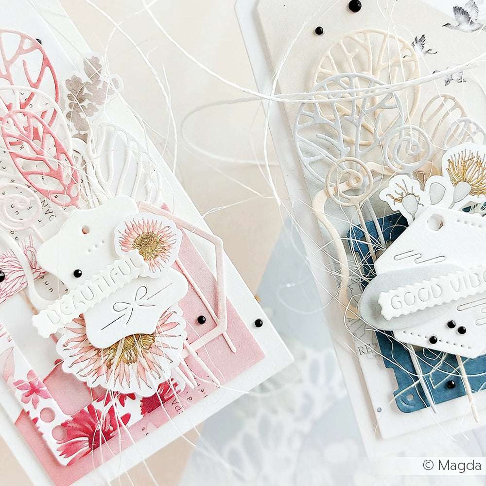 Zwei handgefertigte Alexandra Renke-Grußkarten mit geschichteten Blumenausschnitten, Anhängern aus Dies und Stanzsystemen und aufmunternden Botschaften "Good Vibes" und "Beautiful".