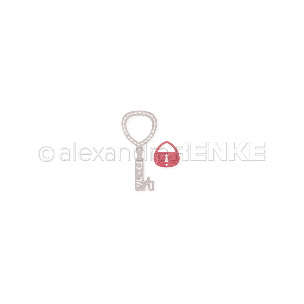 Ein Schlüsselanhänger aus Metall mit einem rosa Schloss und einem weißen Ausrufezeichen, gefertigt mit den „Alexandra Renke Stanzen 100 % Stahl DieCut“-Systemen, dargestellt auf weißem Hintergrund.