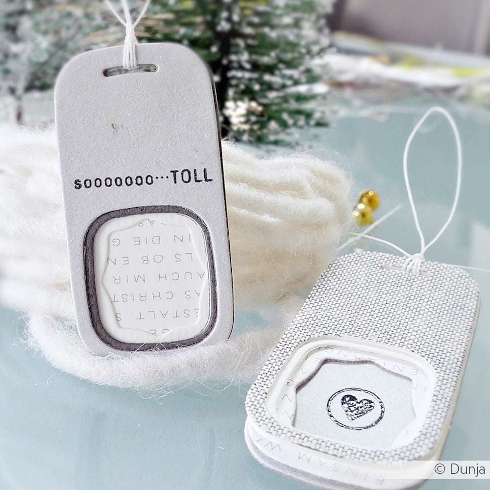 Zwei handgefertigte Geschenkanhänger aus Alexandra Renke Designpapieren mit DieCut Systeme-Fenstern - auf dem einen steht SOOOOOO...TOLL, der andere zeigt eine zarte Herzzeichnung.