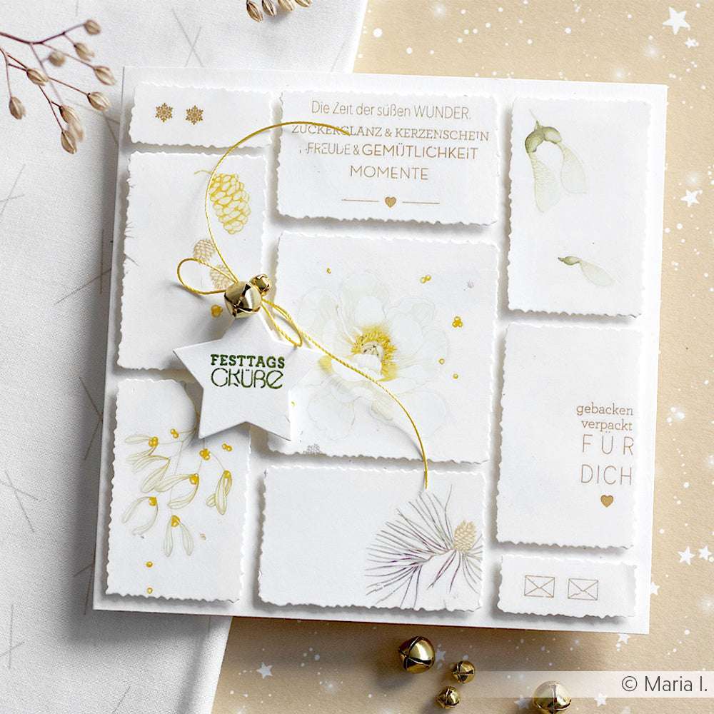 Weiße Festtagskarte von Alexandra Renke mit goldenen Akzenten, botanischen Illustrationen und "Festtagsgrüßen" auf einem Sternanhänger, hergestellt mit Dies für Stanzsysteme und Motivstanze Rechteckige Schicht-Etiketten für elegante Schichteffekte.