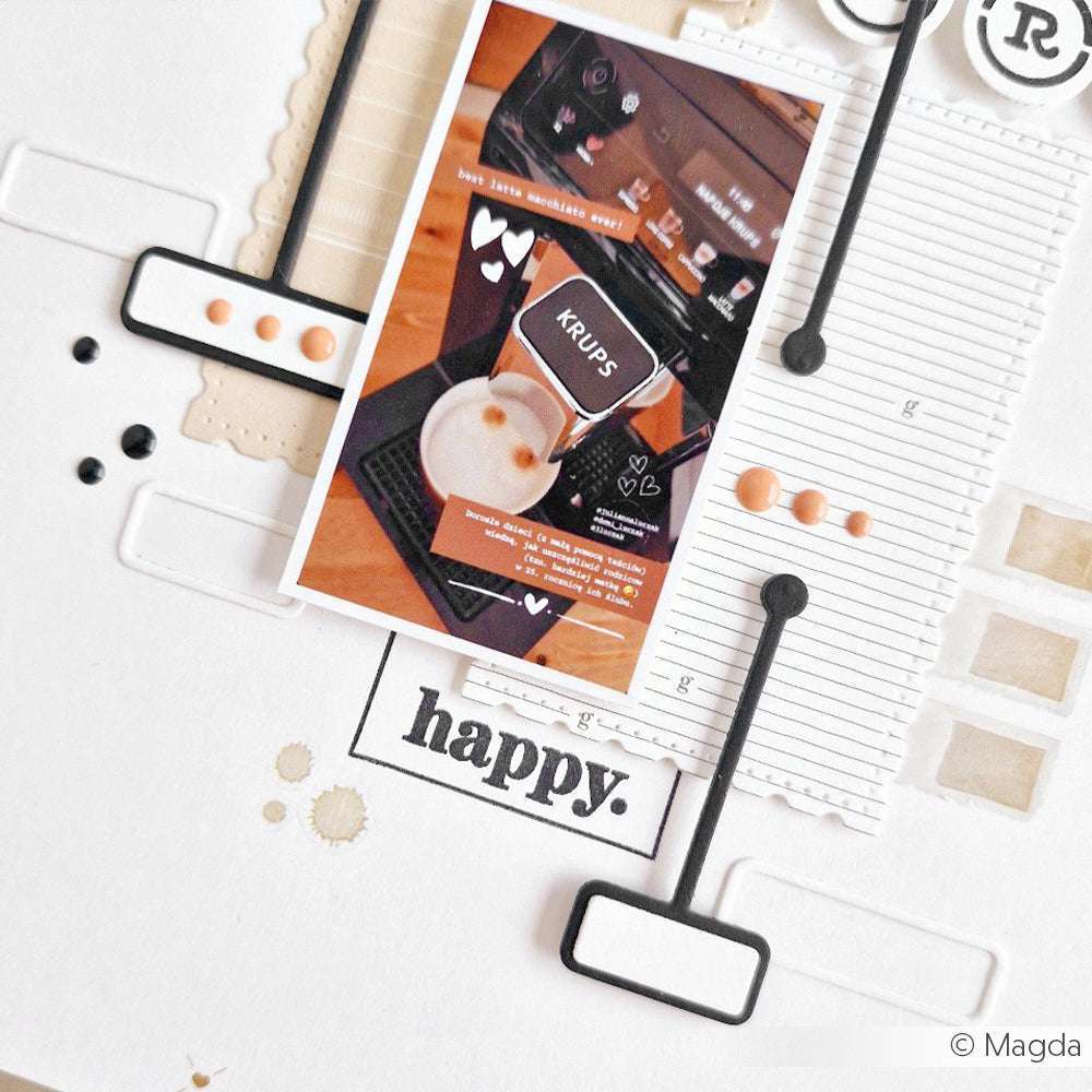 Eine Scrapbook-Seite zum Thema Kaffee mit einem Foto einer Krups-Kaffeemaschine, dem Wort "happy" und kreativen dekorativen Akzenten, die mit Alexandra Renke Deep Edge Motivstanzen hergestellt wurden.