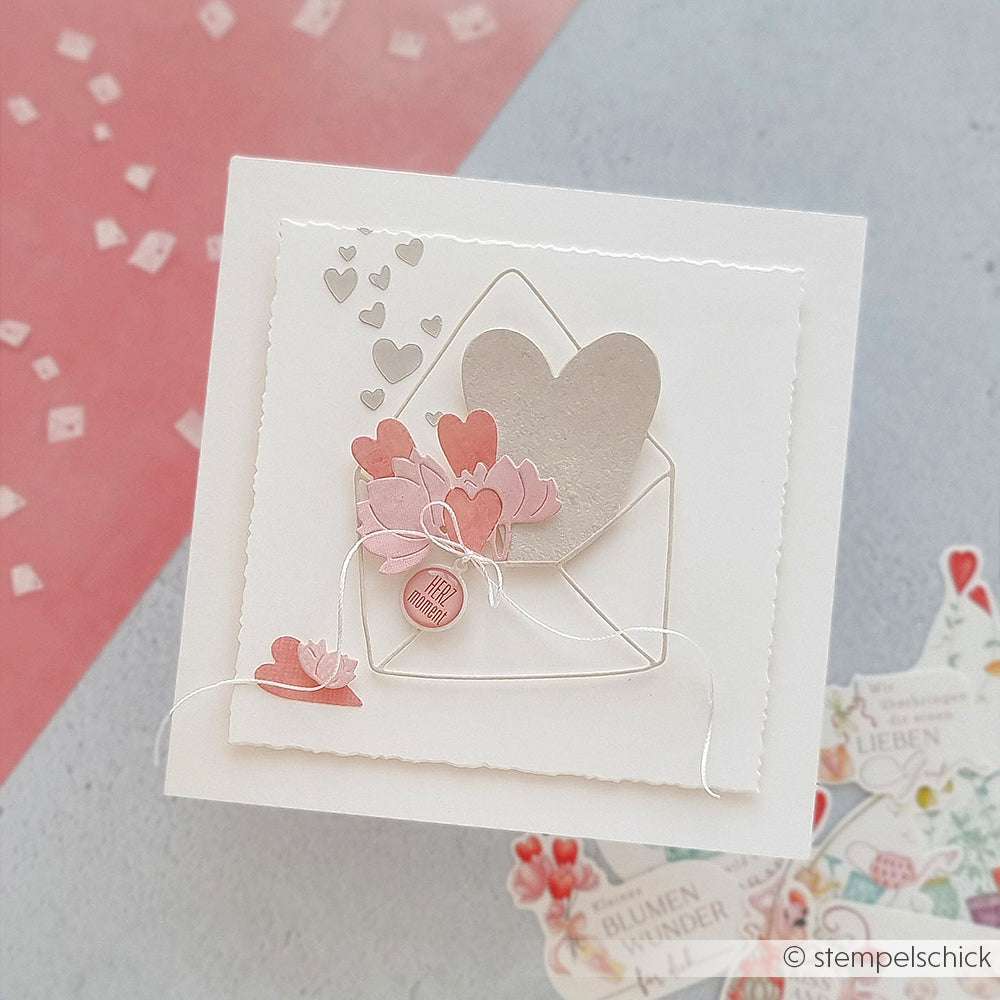 Handgefertigte Karte mit Umschlag von Alexandra Renke mit einem silbernen Herz, rosa Blumen und Herz-Akzenten auf weißem Untergrund - hergestellt mit Deep Edge Motivstanzen für detaillierte Stanzmuster.