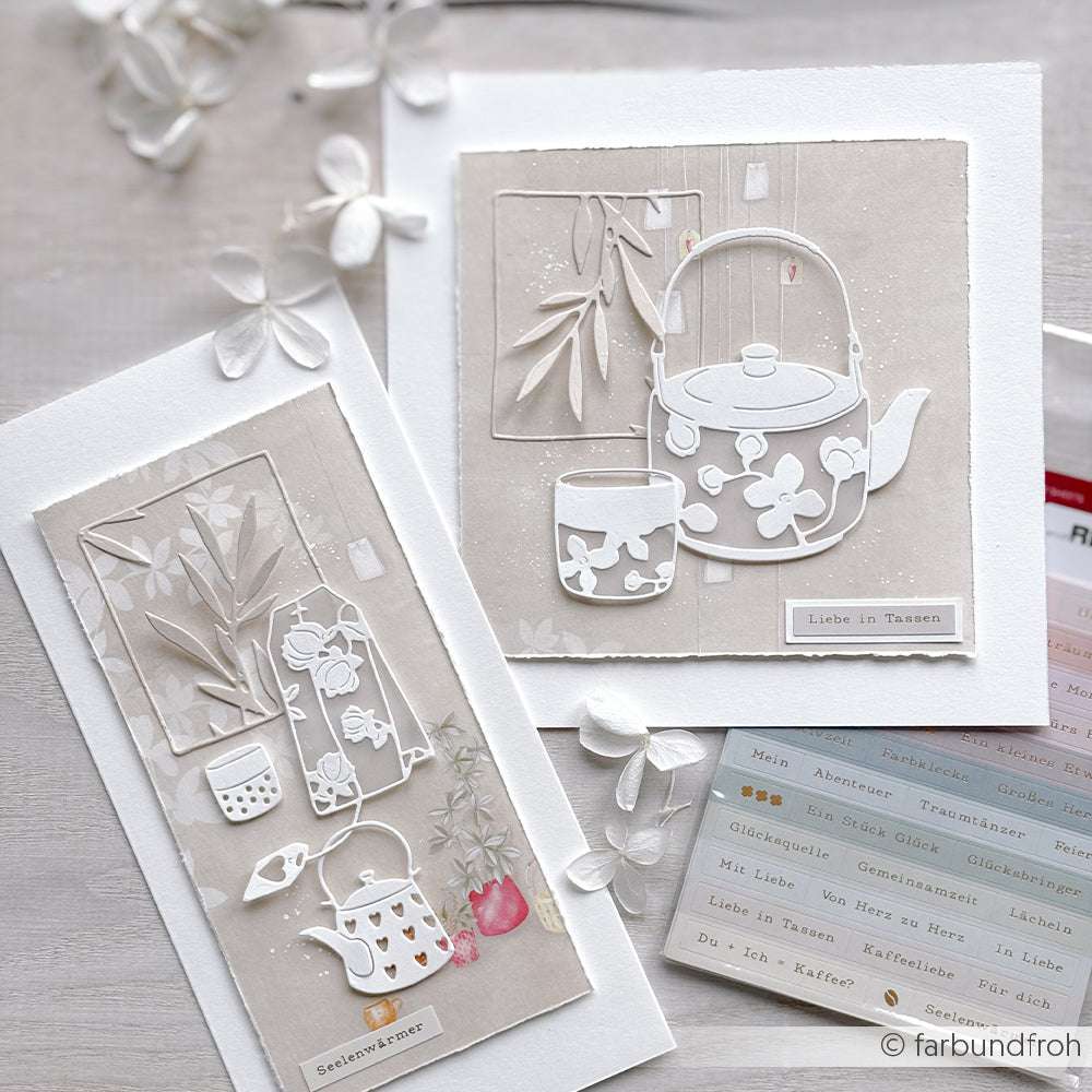 Zwei handgefertigte Karten von Alexandra Renke mit Teekannen- und Pflanzenmotiven in sanften Neutraltönen, die mit Deep Edge Stanzen und PAPPcut®ies gestaltet und mit Papierblumen und Stickern verziert wurden.