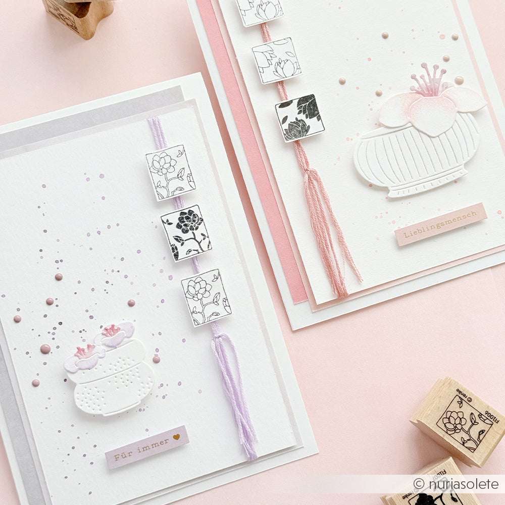 Zwei handgefertigte Blumengrußkarten von Alexandra Renke mit pastellfarbenen Motiven, Quasten und geprägten Blumenmotiven, die mit PAPPcut®ies und Deep Edge Motivstanzen für filigrane Details hergestellt wurden.