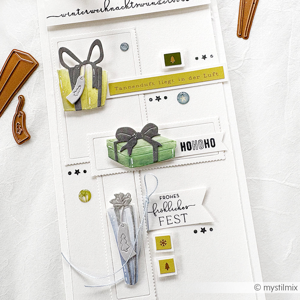 Handgefertigte Weihnachtskarte von Alexandra Renke mit eingepackten Geschenken, festlichen Anhängern und deutschen Weihnachtsgrüßen in einem minimalistischen Stil, hergestellt mit PAPPcut®ies und mit Motivstanze Briefmarken für Eleganz.