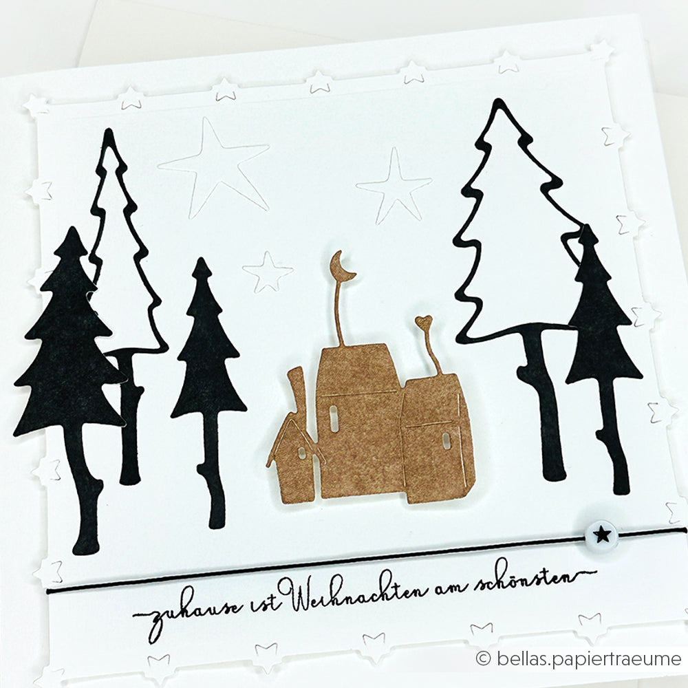 Handgefertigte Weihnachtskarte von Alexandra Renke mit schwarzen Bäumen, braunen Häusern und Sternakzenten, gestaltet mit Designpapieren und deutschem Text. Perfekt für festliche Grüße mit Ihren Lieblings-Stanzsystemen.
