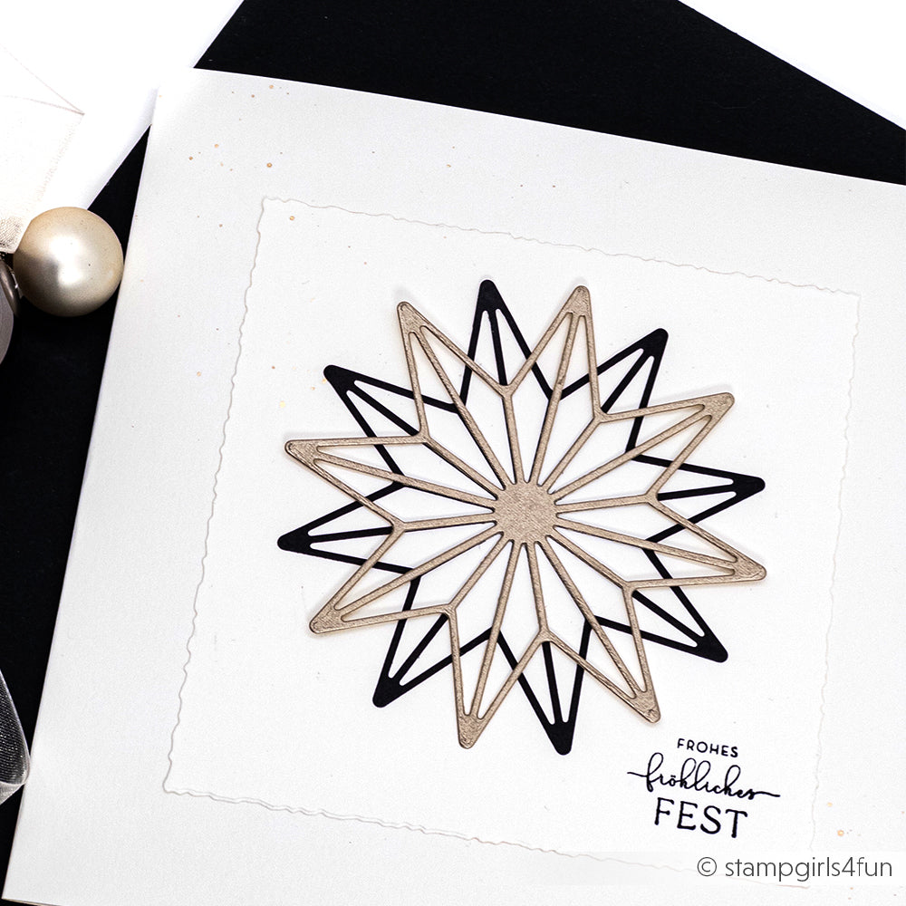Geometrisches Sternmotiv von Alexandra Renke, gefertigt mit Motivstanze Achterstern in Schwarz und Beige auf weißer Karte mit der Aufschrift "Frohes festlicher FEST" am unteren Rand.