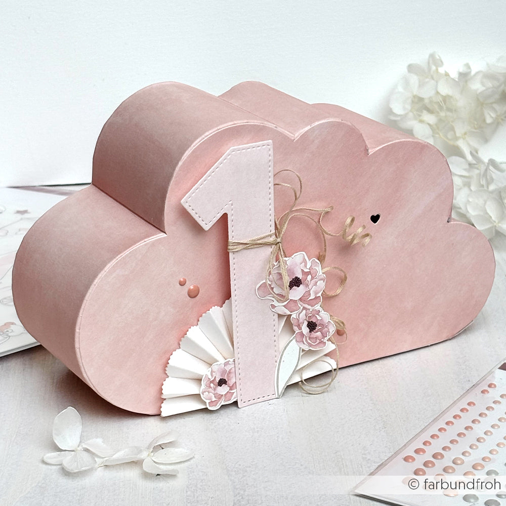 Eine rosafarbene Wolkenschachtel von Alexandra Renke, gefertigt mit Motivstanze Wolke und verziert mit zarten Blumen und einer großen "1" - ideal für einen ersten Geburtstag.