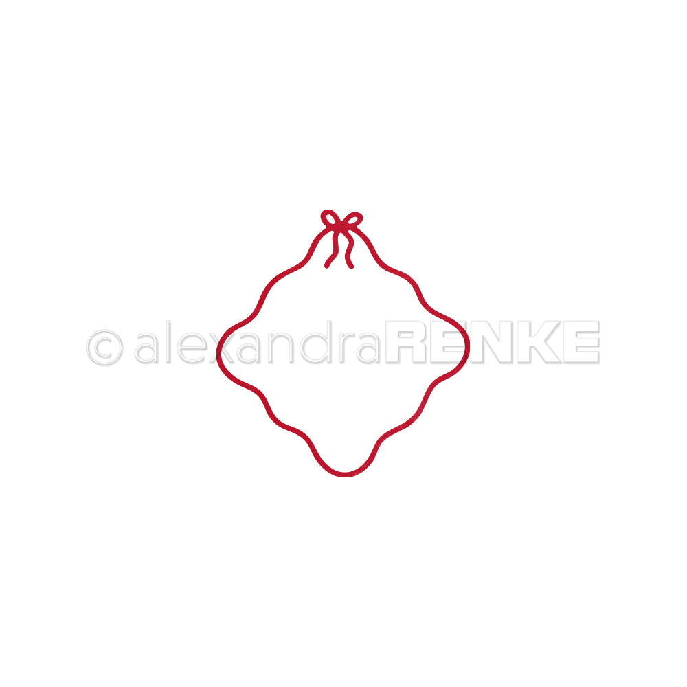 Ein roter Wellenrand mit einer kleinen Schleife an der Spitze, hergestellt mit der Alexandra Renke Motivstanze Wellenrand-Rahmen, dargestellt auf weißen Designpapieren.