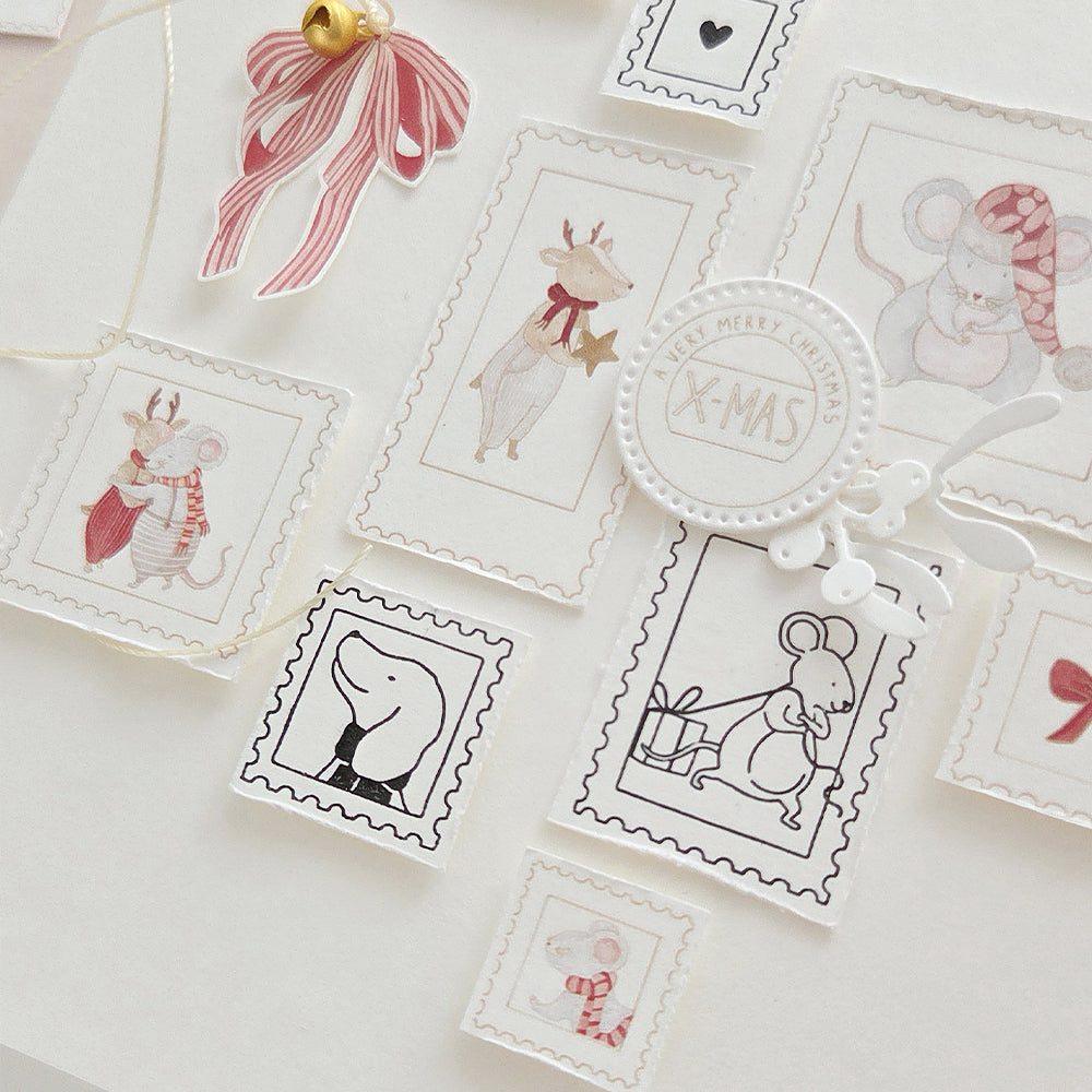 Verschiedene Holzstempel mit Weihnachtsmotiven, darunter Mäuse und Rentiere.