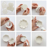 Eine Schritt-für-Schritt-Anleitung zeigt, wie man mit der Alexandra Renke Motivstanze Achteckbox weißes Papier faltet und klebt, um eine kleine achteckige Schachtel herzustellen.