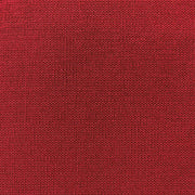 Nahaufnahme des leuchtend roten Buchleinen-Stoffes von ☆, der eine ausgeprägte gewebte Struktur aufweist.