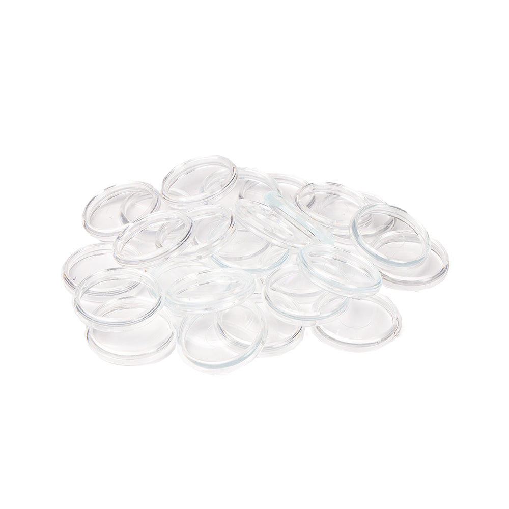 Ein Stapel klarer, runder Alexandra Renke Bindescheiben auf weißem Hintergrund.