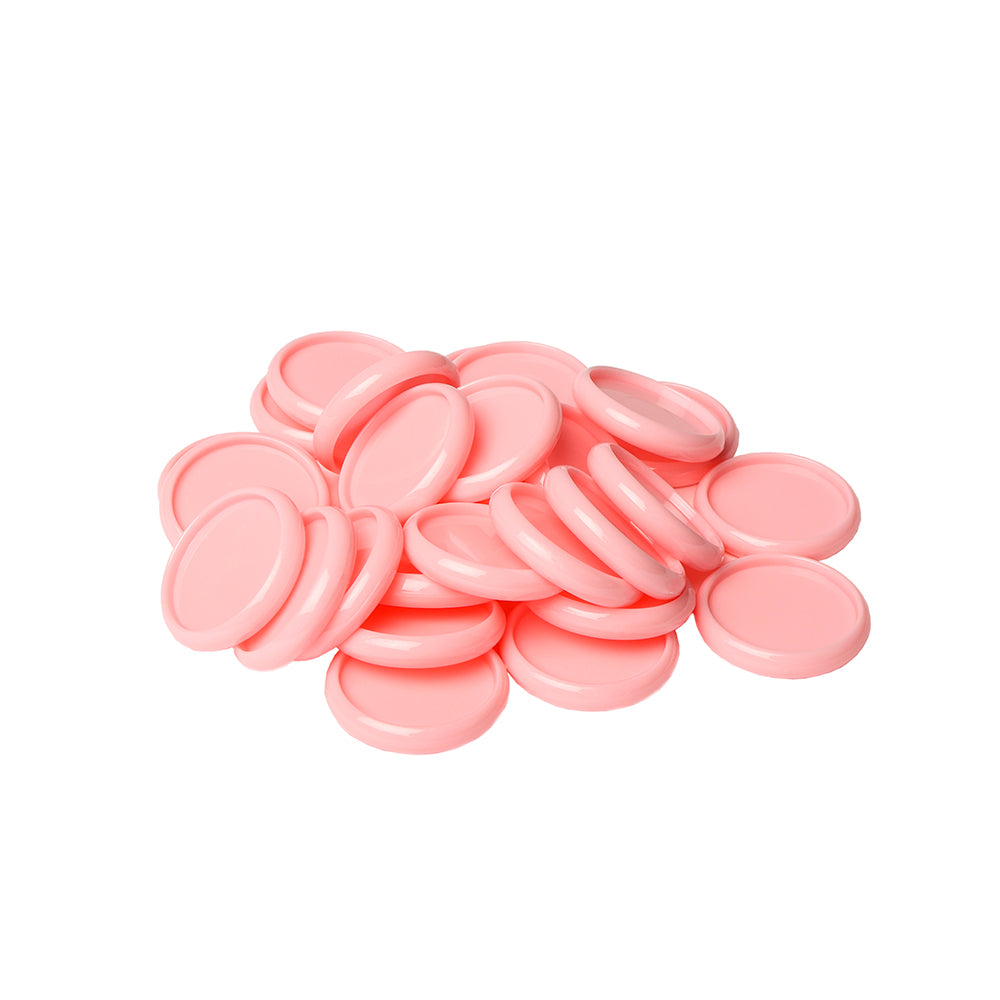 Ein Stapel runder, flacher, pinkfarbener Kunststoff-Bindescheiben von Alexandra Renke auf weißem Hintergrund - ideal als Bindeelemente für Ihr nächstes Mini-Album-Projekt.